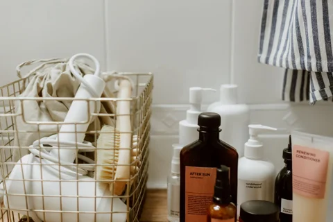 Bathroom accessories held in a wire basket