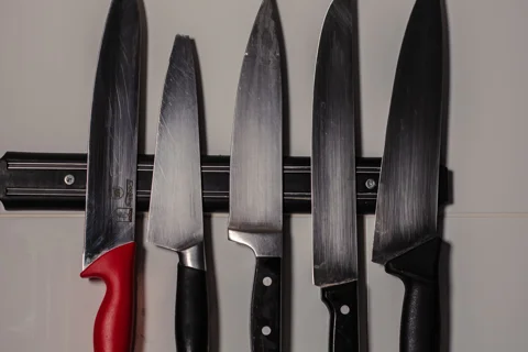 Kitchen knives stored on a wall strip