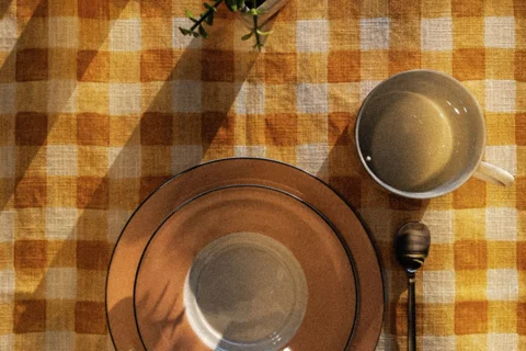 A small table set with plates and cups