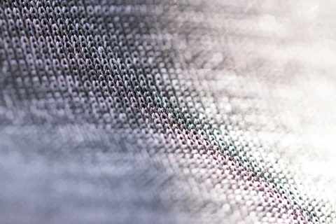 A close view of woven grey threads