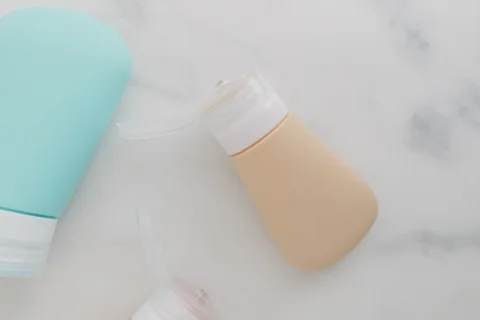 A small squeezable toiletry bottle with flip cap